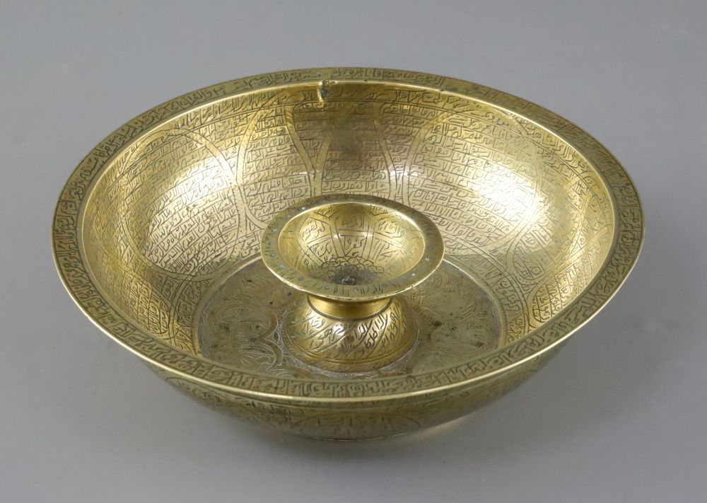 A large brass Persian magic bowl, Qajar dynasty, with inscribed decoration, diameter 21cm